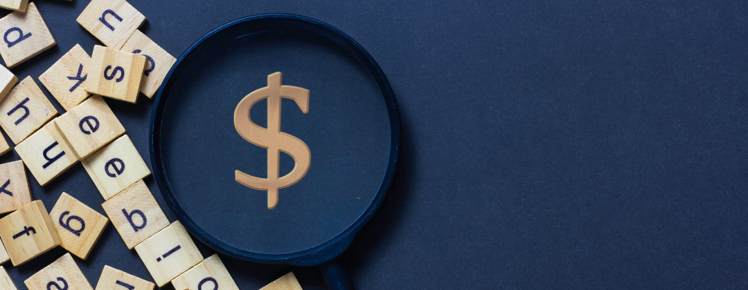 magnifying glass with a dollar sign inside and scattered scrabble letter blocks on a blue background.