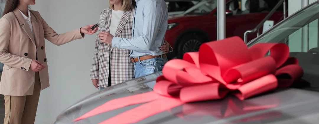new car with red bow