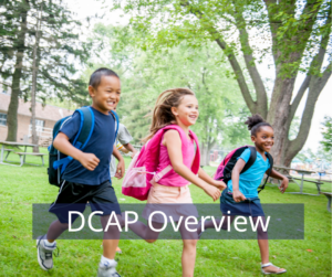 Three children with backpacks running on grass, smiling, with trees in the background; "DCAP Overview" text overlay at the bottom.
