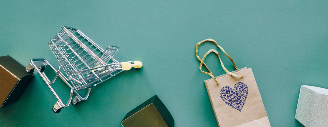 Green background shopping cart and shopping bag