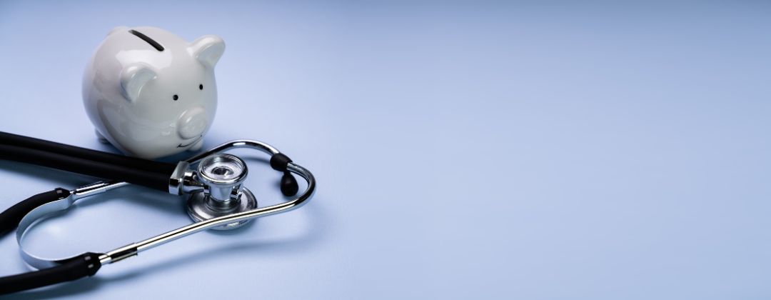 piggy bank and stethoscope.