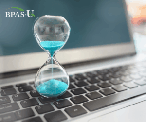 Image of an hourglass on a laptop