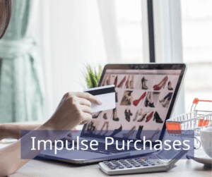 image of person with credit card in hand, looking at laptop of shoes to purchase