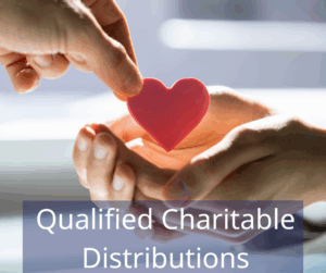 two hands holding a heart. Text overlay: Qualified Charitable Distributions